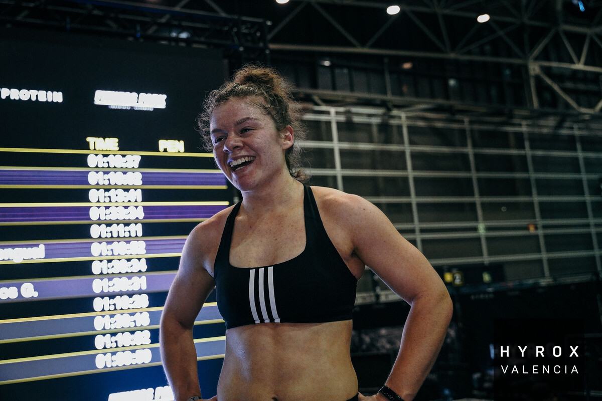 Mimi Paton, Hyrox World Championship athlete and personal trainer in Birmingham, celebrating after a race