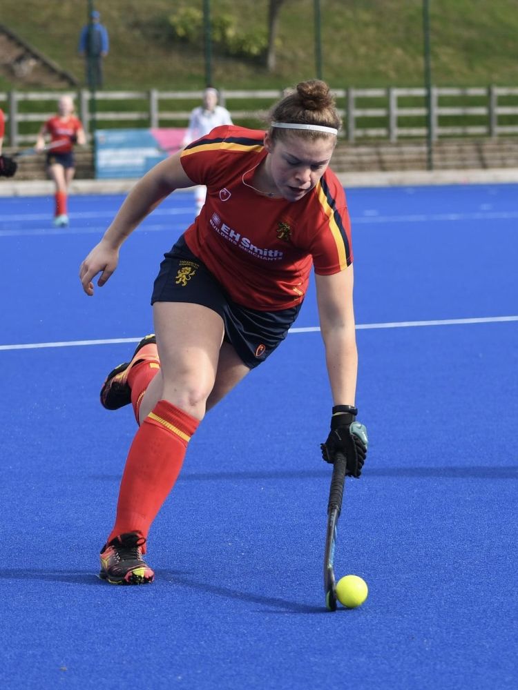 Mimi Paton playing hockey