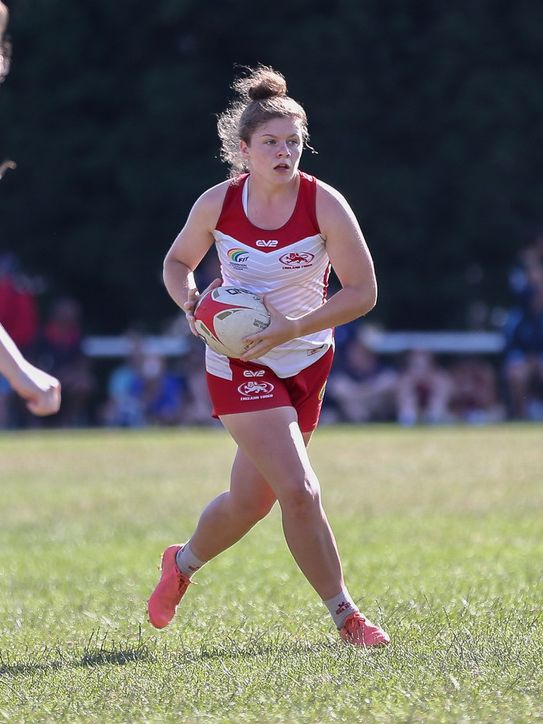 Mimi Paton playing touch rugby for England, showing the multi-sport background behind her Birmingham personal training coaching